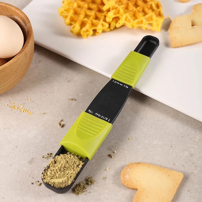 Antioxi Adjustable Measuring Spoon containing mushroom powder, with the slider set to 13g, demonstrating precise measurement capability.