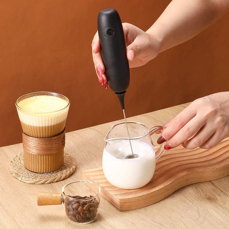 Antioxi Electric Whisk mixing mushroom extract supplements into milk for a coffee, showcasing a convenient and smooth blending experience in a lifestyle setting.