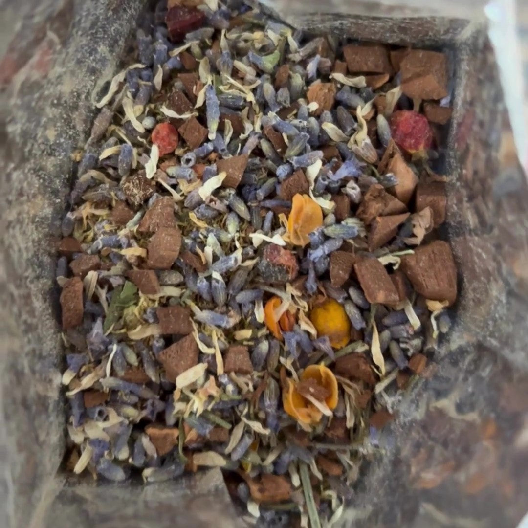 View of the inside of Antioxi Calm Mushroom Tea packaging, showcasing the loose leaf ingredients inside.