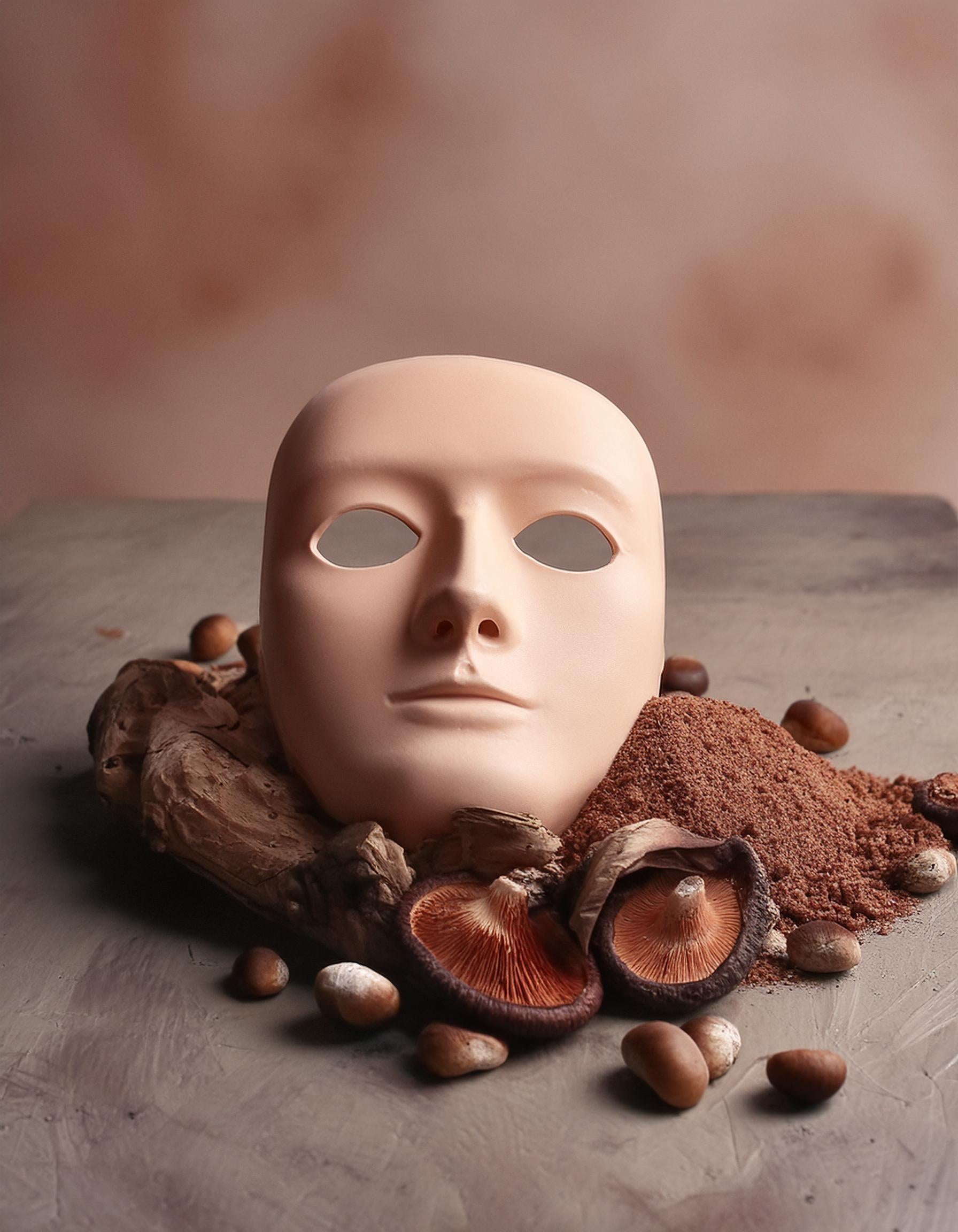 Face Mask on a heap of brown mushroom powder extract surrounded by mushrooms, symbolizing support for Skin health