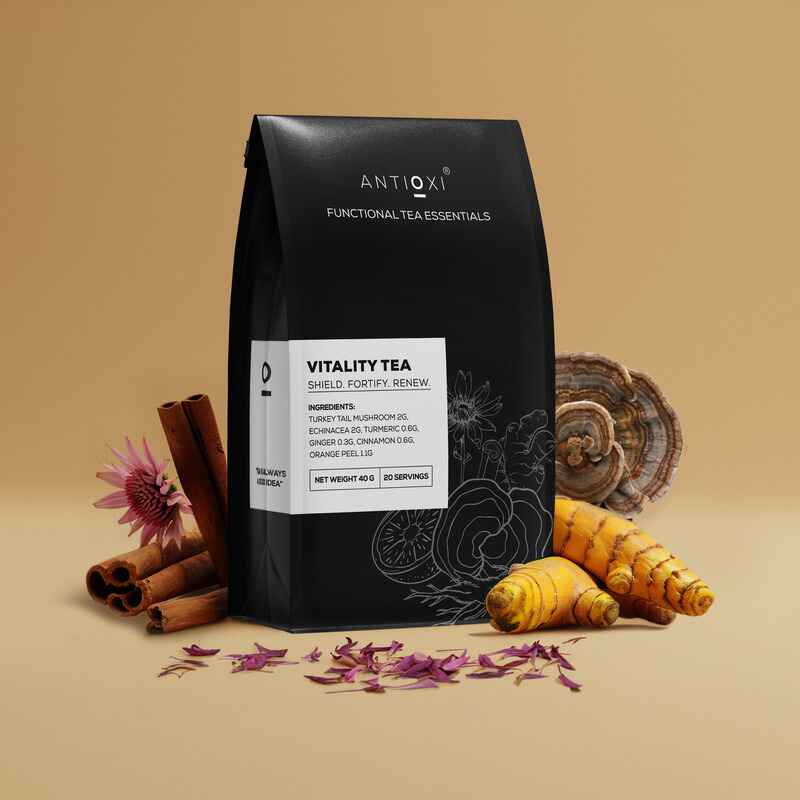 Antioxi Vitality Mushroom Tea package surrounded by key ingredients like cinnamon, turmeric, and Turkey Tail mushroom, emphasizing its health benefits and natural components.